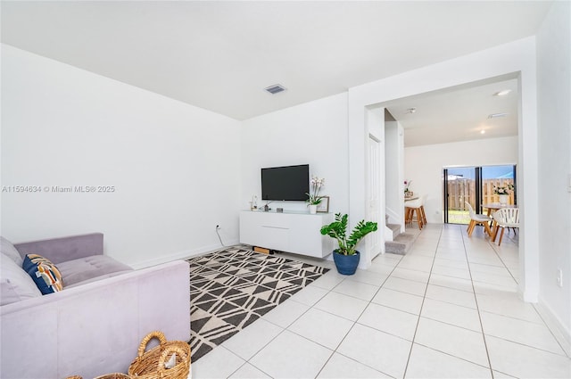 living room with light tile patterned flooring