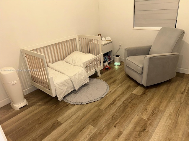 bedroom with hardwood / wood-style flooring