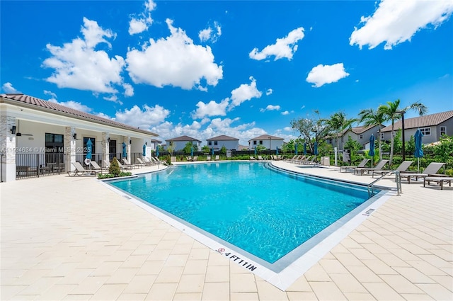 view of swimming pool with a patio