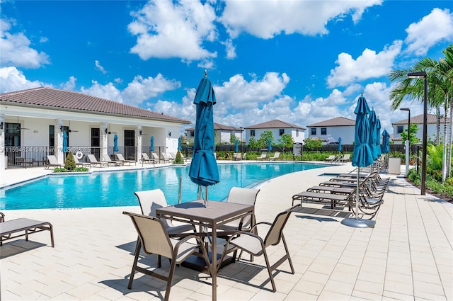 view of swimming pool featuring a patio area