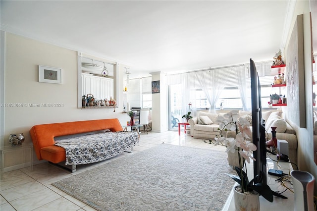 living room featuring light tile patterned floors and ornamental molding