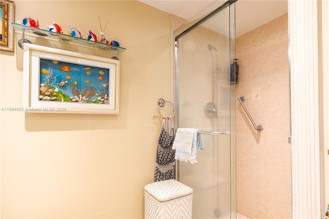 bathroom with a shower with shower door