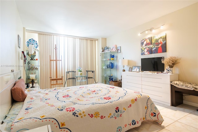 bedroom with light tile patterned floors