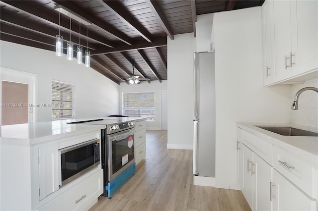 kitchen with white cabinetry, stainless steel appliances, sink, and plenty of natural light