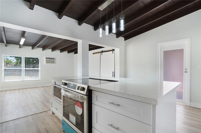 kitchen featuring stainless steel electric stove, a barn door, wooden ceiling, and white cabinets