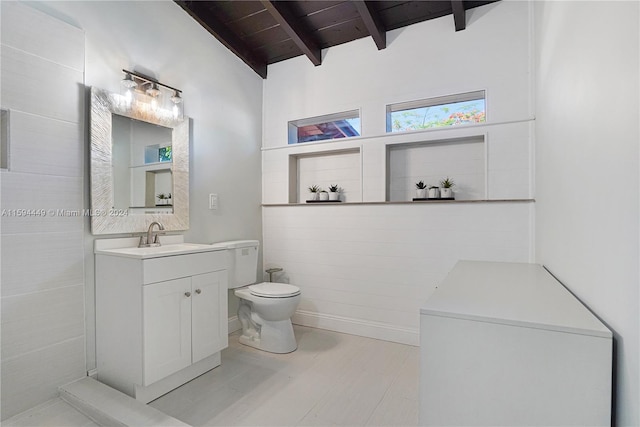 bathroom with vanity, tile patterned floors, lofted ceiling with beams, toilet, and wood ceiling