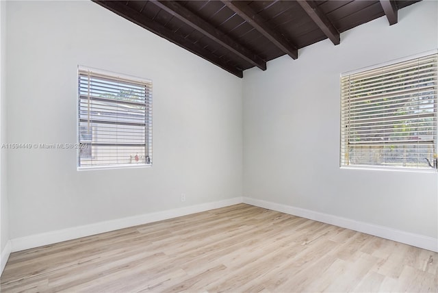 spare room with wooden ceiling, a healthy amount of sunlight, lofted ceiling with beams, and light wood-type flooring