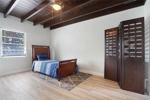 bedroom with beam ceiling, wooden ceiling, ceiling fan, and light wood-type flooring