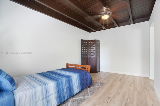 bedroom with vaulted ceiling with beams, wooden ceiling, ceiling fan, and hardwood / wood-style floors