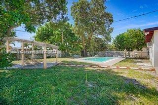 view of yard with a fenced in pool