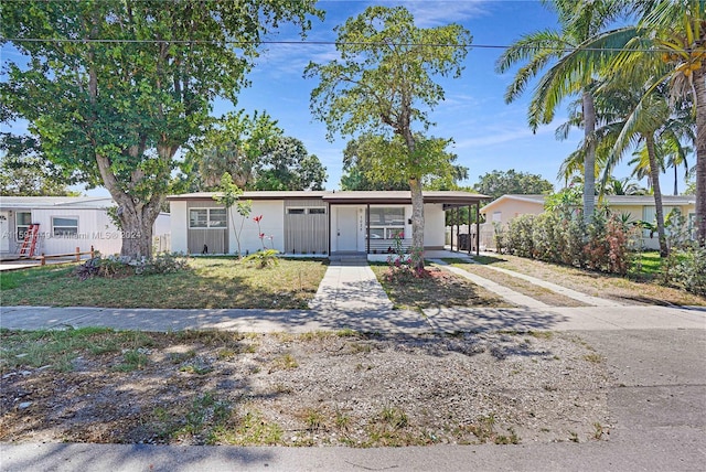 view of front facade with a carport