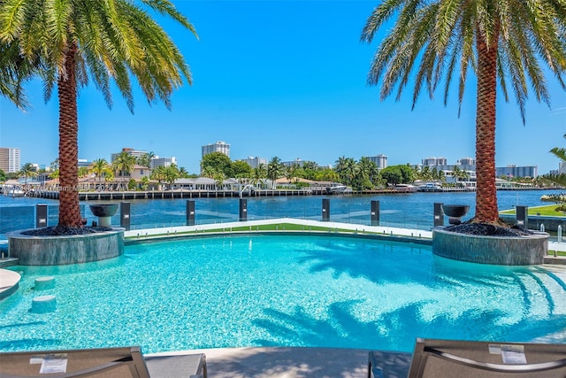 view of swimming pool featuring a water view