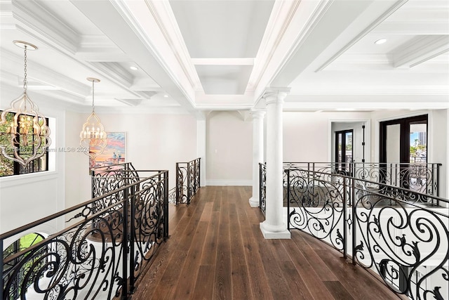 hallway with ornamental molding, dark hardwood / wood-style flooring, a notable chandelier, and beam ceiling