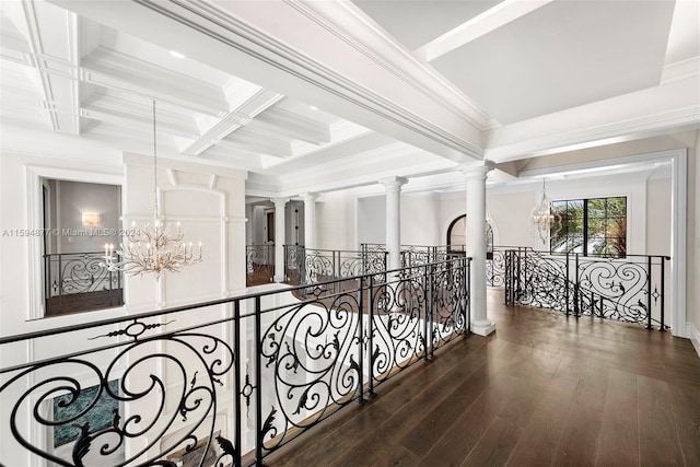 hallway featuring beamed ceiling, dark hardwood / wood-style flooring, coffered ceiling, and an inviting chandelier