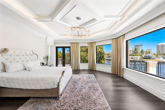 bedroom with beam ceiling, crown molding, dark hardwood / wood-style flooring, and french doors