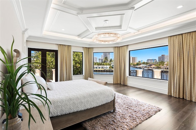 bedroom featuring dark hardwood / wood-style floors, multiple windows, coffered ceiling, and a water view