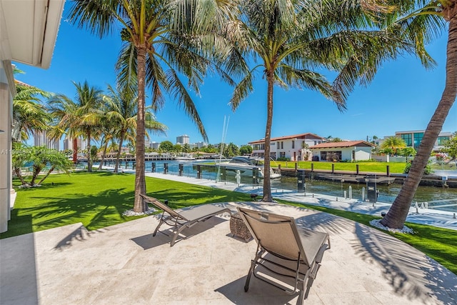 view of patio featuring a water view and a boat dock