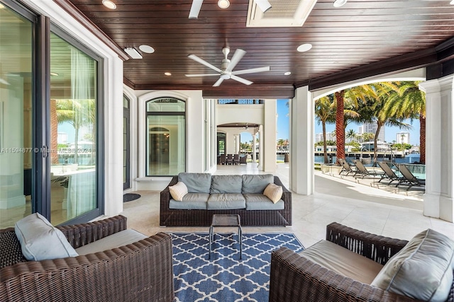 view of patio featuring ceiling fan and an outdoor living space