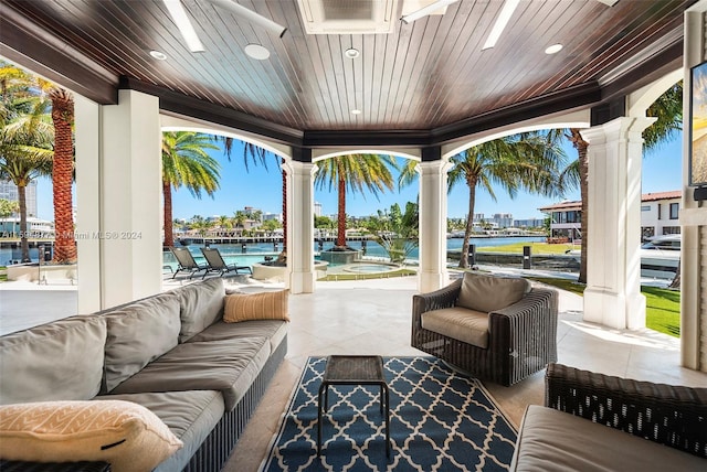 view of patio / terrace featuring an outdoor hangout area and a water view