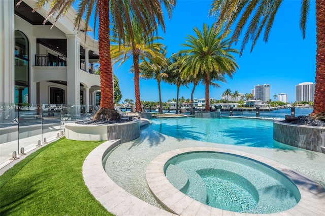 view of pool featuring an in ground hot tub