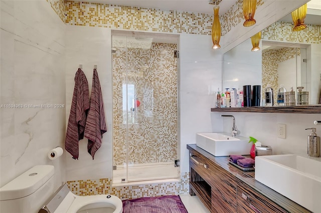 bathroom featuring tile walls, a bidet, toilet, walk in shower, and vanity