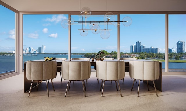 sunroom / solarium with a water view and an inviting chandelier