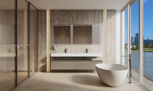 bathroom with vanity and floor to ceiling windows