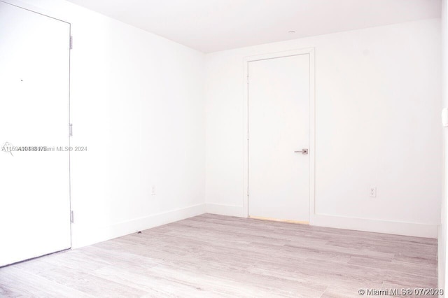 unfurnished room with light hardwood / wood-style floors