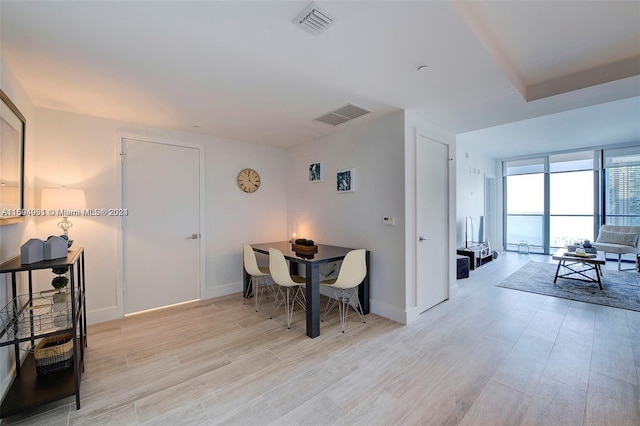 dining room with light hardwood / wood-style flooring