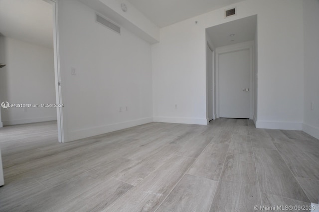 spare room with light hardwood / wood-style flooring