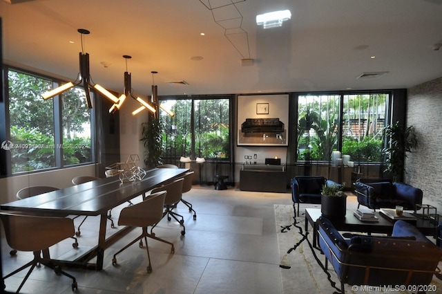 dining room featuring a wealth of natural light and light tile flooring