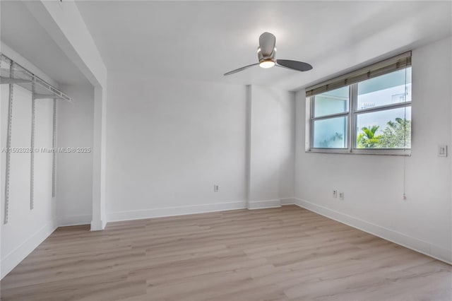 unfurnished bedroom with light hardwood / wood-style flooring and ceiling fan