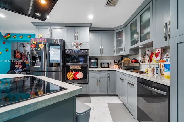 1651 NW 111th St, Miami, FL 33167 - kitchen featuring black appliances, light marble finish floors, gray cabinets, light countertops, and recessed lighting