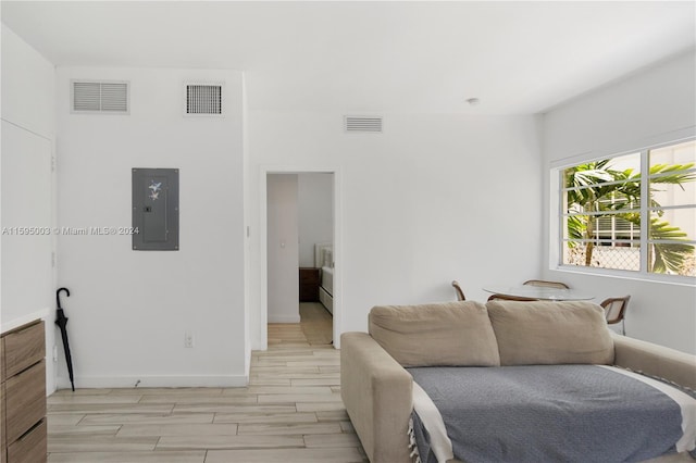 1560 Meridian Ave Unit 108, Miami Beach, FL 33139 - living room with electric panel, baseboards, and wood tiled floors