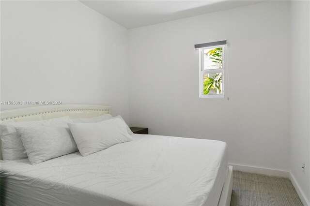 1560 Meridian Ave Unit 108, Miami Beach, FL 33139 - bedroom featuring baseboards and carpet floors