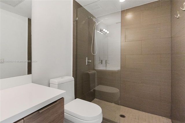 bathroom with walk in shower, oversized vanity, and toilet