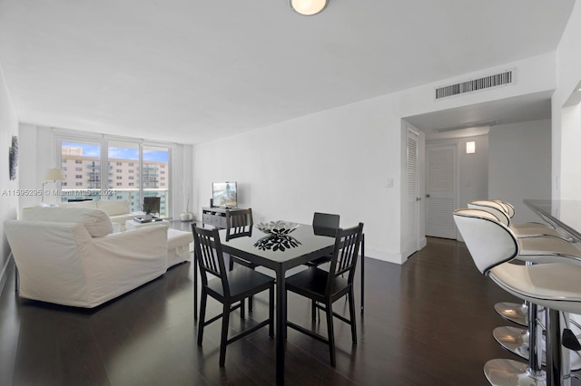 dining room with dark hardwood / wood-style floors