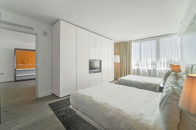 bedroom featuring wood-type flooring