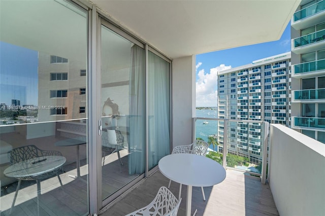 balcony featuring a water view