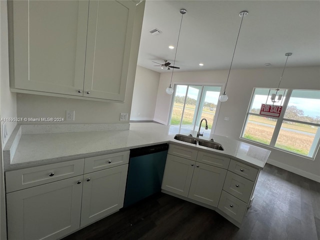 kitchen with pendant lighting, dishwasher, kitchen peninsula, and sink