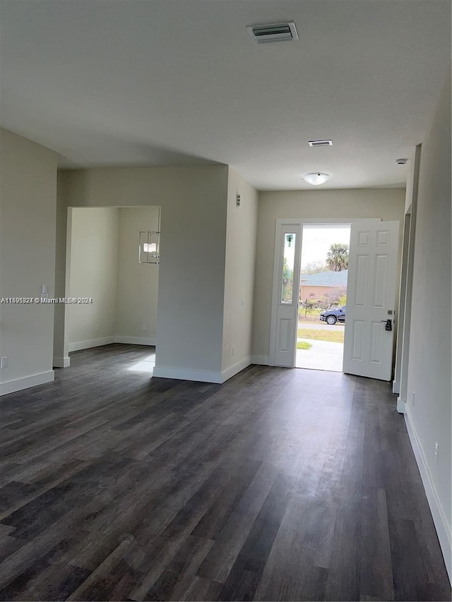 empty room featuring dark wood-type flooring