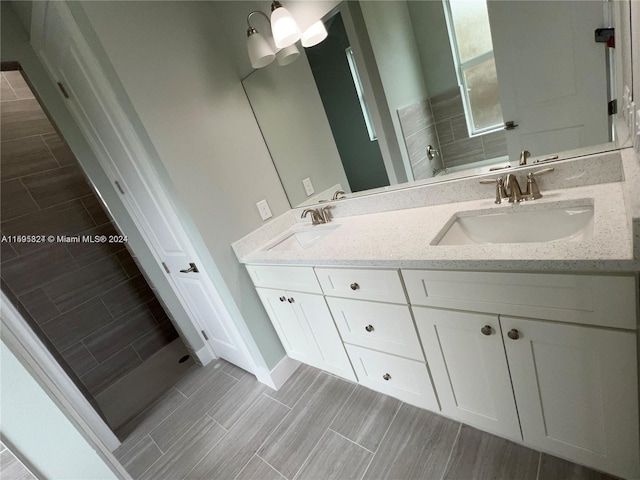 bathroom featuring tasteful backsplash and vanity