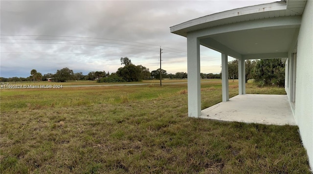 view of yard with a patio and a rural view