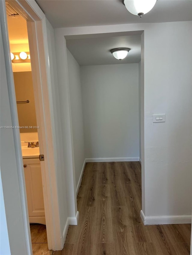 corridor featuring hardwood / wood-style flooring