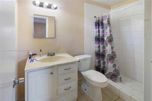 bathroom featuring a shower with shower curtain, vanity, tile patterned flooring, and toilet