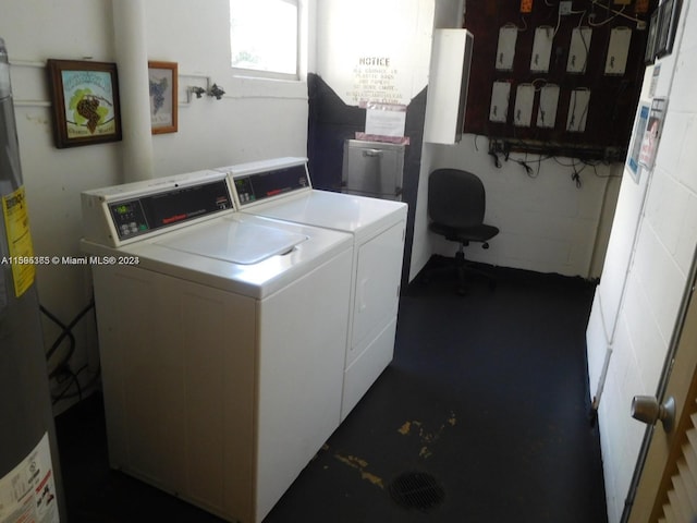clothes washing area featuring separate washer and dryer