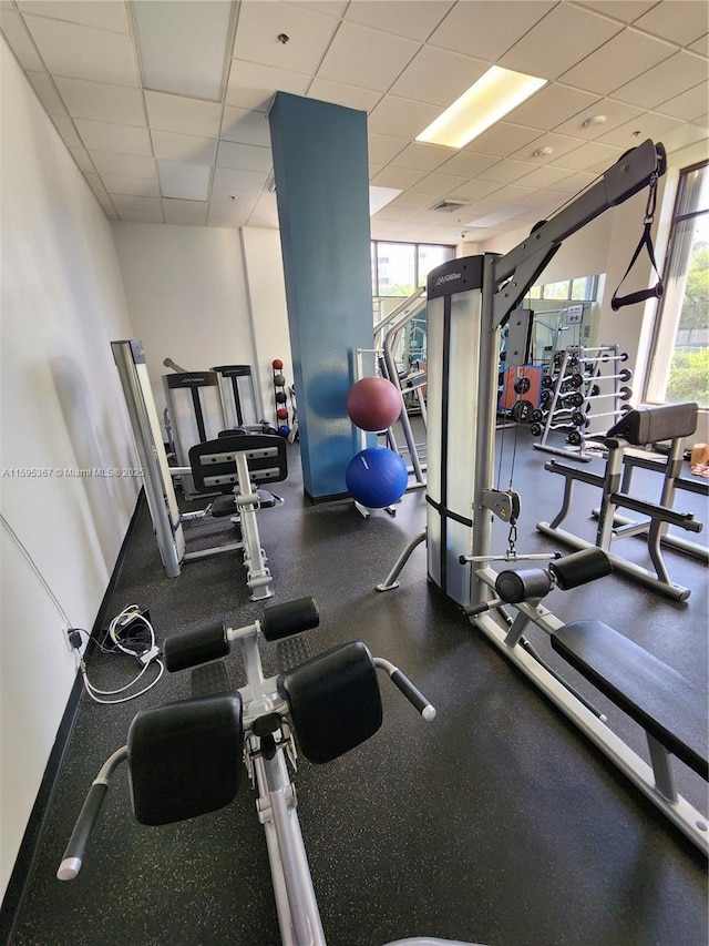 gym featuring a drop ceiling