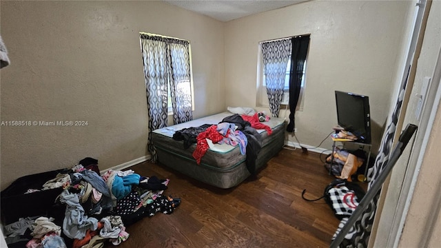 bedroom featuring dark hardwood / wood-style floors