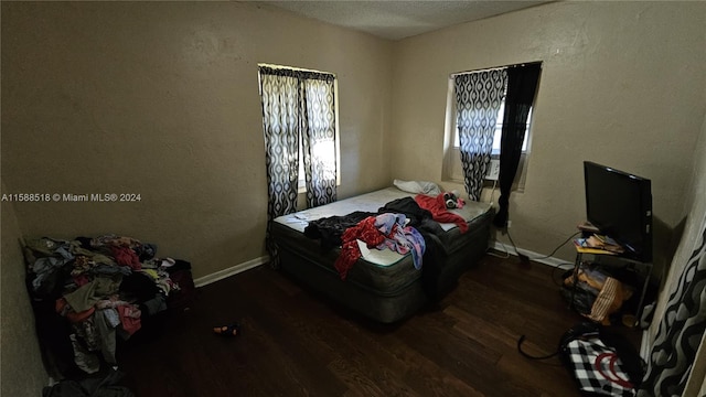 bedroom featuring dark wood-type flooring