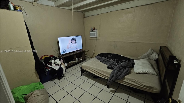 tiled bedroom featuring a wall mounted air conditioner